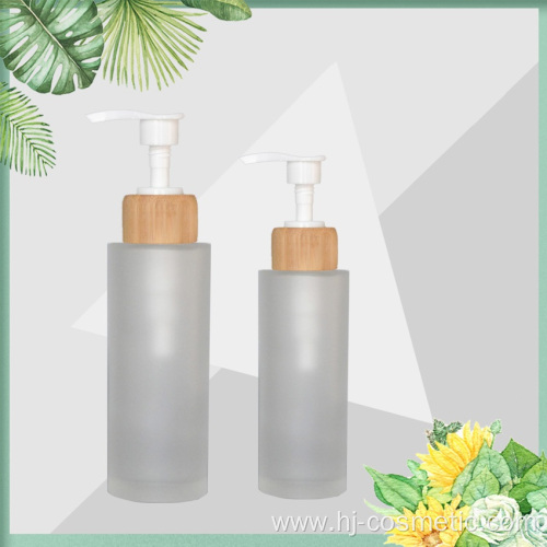 wholesale Frost 150ml 100ml glass bottle with bamboo wooden lotion sprayer pump Customized Made Cosmetic packaging